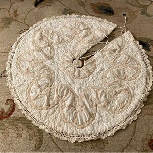 Vintage handmade quilt tree skirt with crochet lace. Farmhouse cottagecore style
